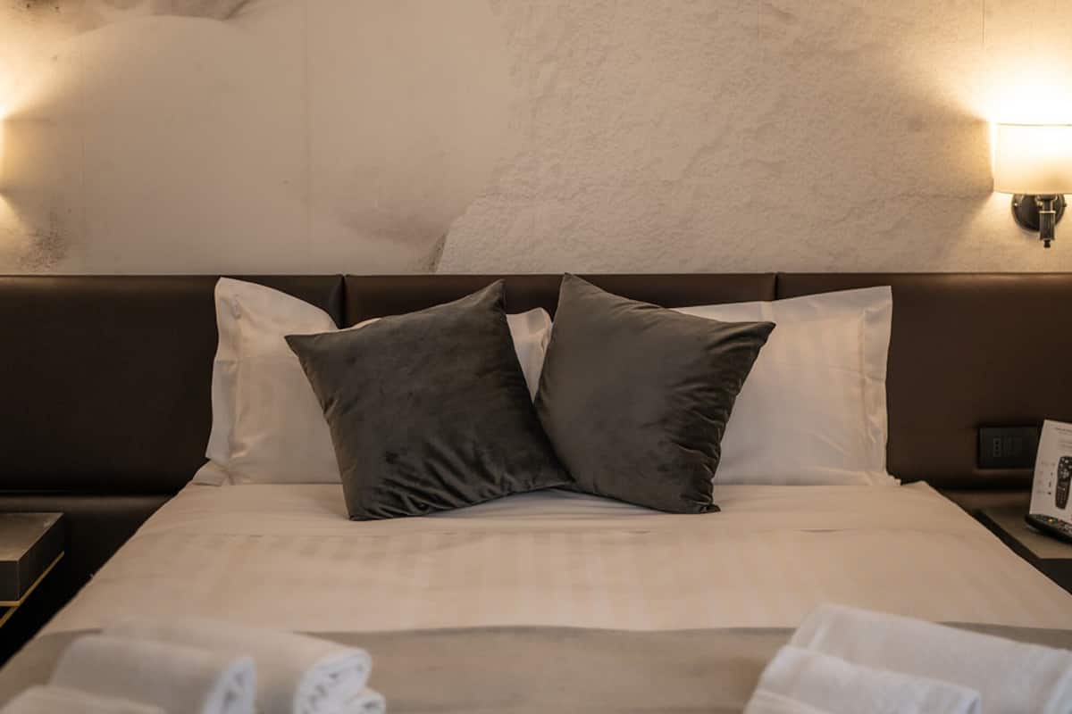 Premium bedding, down duvets, memory-foam beds, minibar