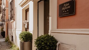 A boutique hotel entrance with a sign reading "Relais Manzoni Boutique Hotel." - Relais Manzoni (Rome)