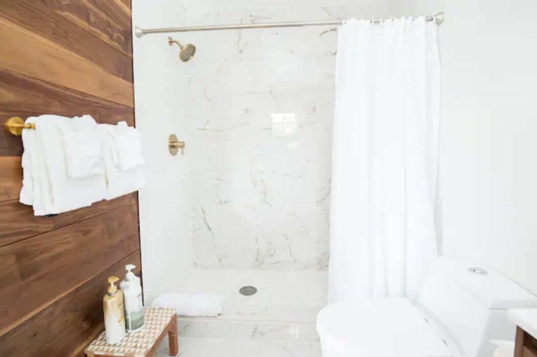 Bathtub, hair dryer, towels, soap