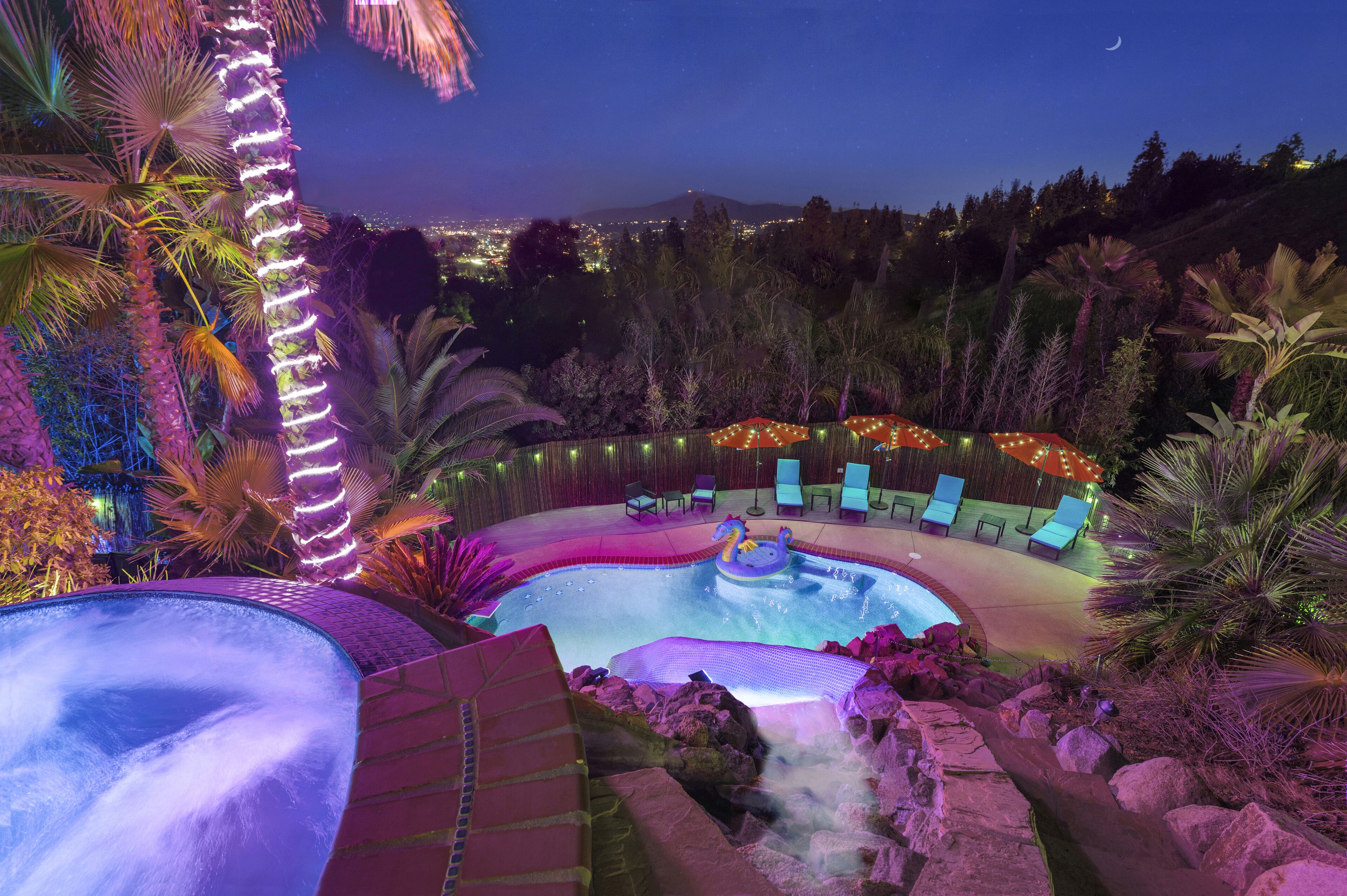 Tropical Paradise with Pool, Spa, Waterslide, Games & Sweeping City Views!