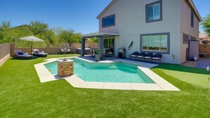 A two-story house with a swimming pool, outdoor seating, and a covered patio area. - 1/2 Mi to Lake: Family Home w/ Hot Tub in Goodyear (Goodyear)