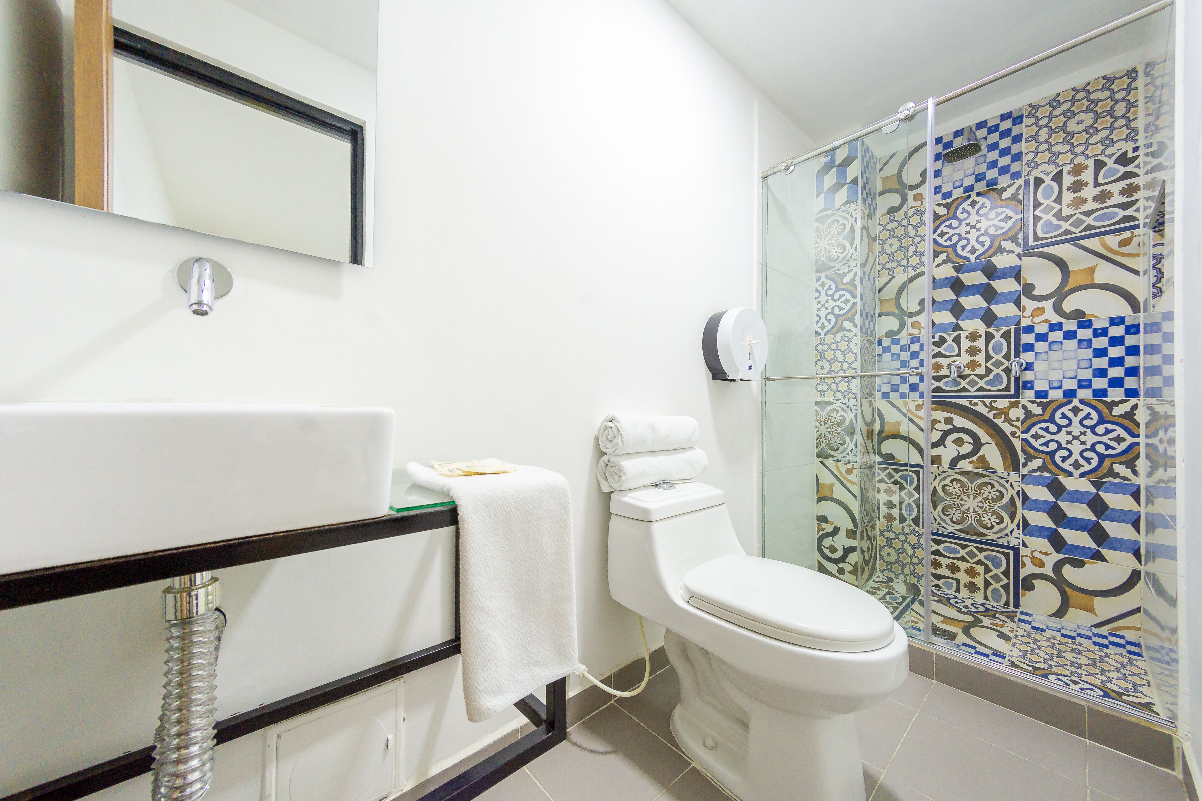 economy double room | bathroom | shower, designer toiletries, towels, soap