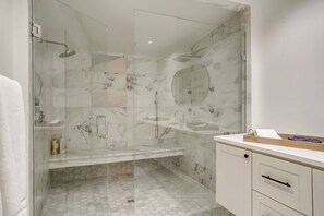 Shower, hair dryer, towels, soap