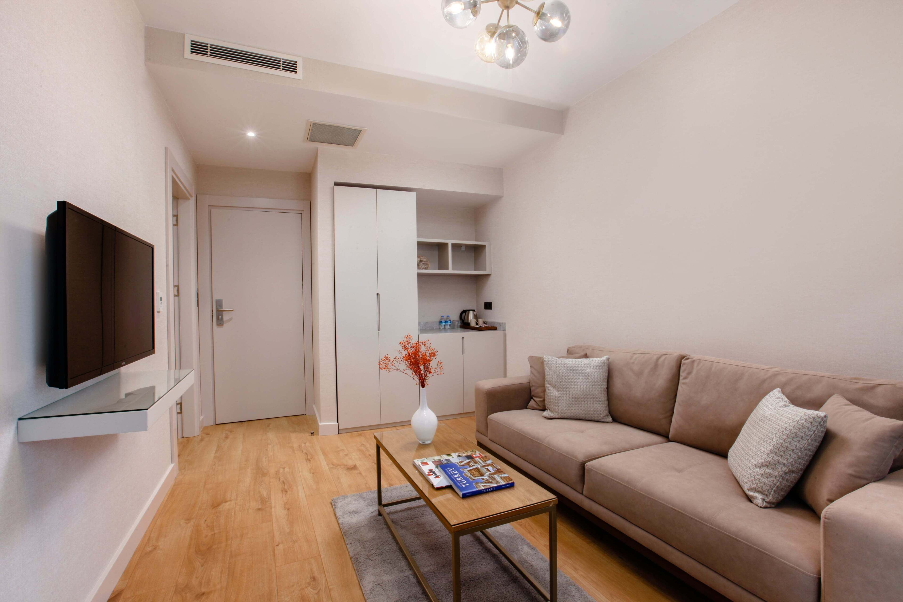 superior suite | living area | 102-inch smart tv with satellite channels, tv