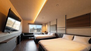 A modern hotel room with a large bed, a sofa, a TV mounted on the wall, and a large window providing a view of the outdoors. - BROOKLYN HOTEL (Sapporo)