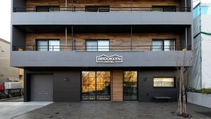 A modern two-story building with a sign reading "Brooklyn Hotel". - BROOKLYN HOTEL (Sapporo)