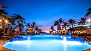 Outdoor pool, a waterfall pool, pool umbrellas, sun loungers