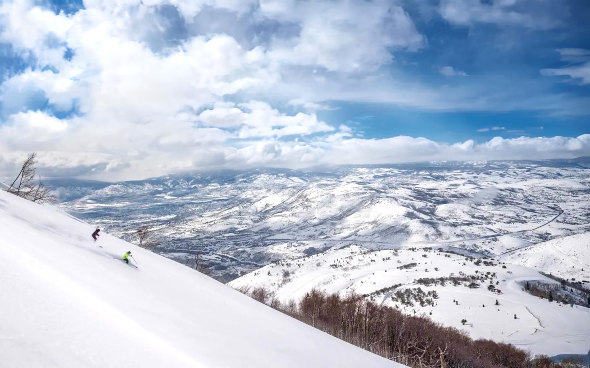 A snow-covered mountain landscape with a clear sky.