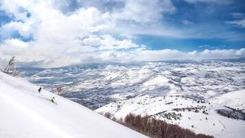 A snow-covered mountain landscape with a clear sky.