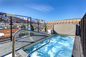 A hot tub with a view of a snowy landscape and a 'NO CLIMBING' sign. - Lift Lodge 2 Bedrooms LLC103 by KBM (Park City)
