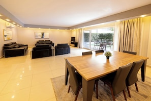 Deluxe Apartment, 3 Bedrooms, Pool View | Living area | 32-inch Smart TV with digital channels, TV