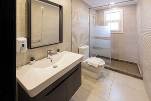 Luxury Suite, 2 Bedrooms, Pool View | Bathroom | Separate tub and shower, spring water tub, rainfall showerhead
