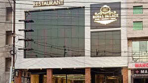 A building with a sign for 'SKG Royal Casino Restaurant' and 'Royal Palace'. - SKG Royal Palace (Bhopal)