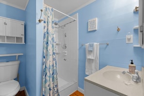 Bathtub, hair dryer, towels, soap