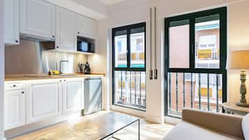 Mini-fridge, microwave, stovetop, cookware/dishes/utensils