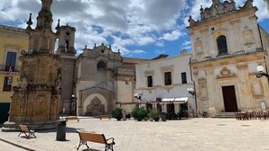 A plaza with historic buildings, a fountain, and benches. - 4 bedroom private vacation home in nardã² (Nardò)