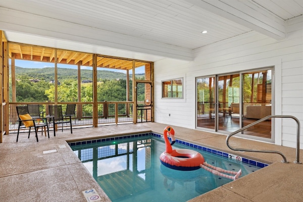 Take a dip in the partially enclosed heated pool | Eaglebend Cabin by Great Smoky Mountains Cabin Rentals | Sevierville, TN