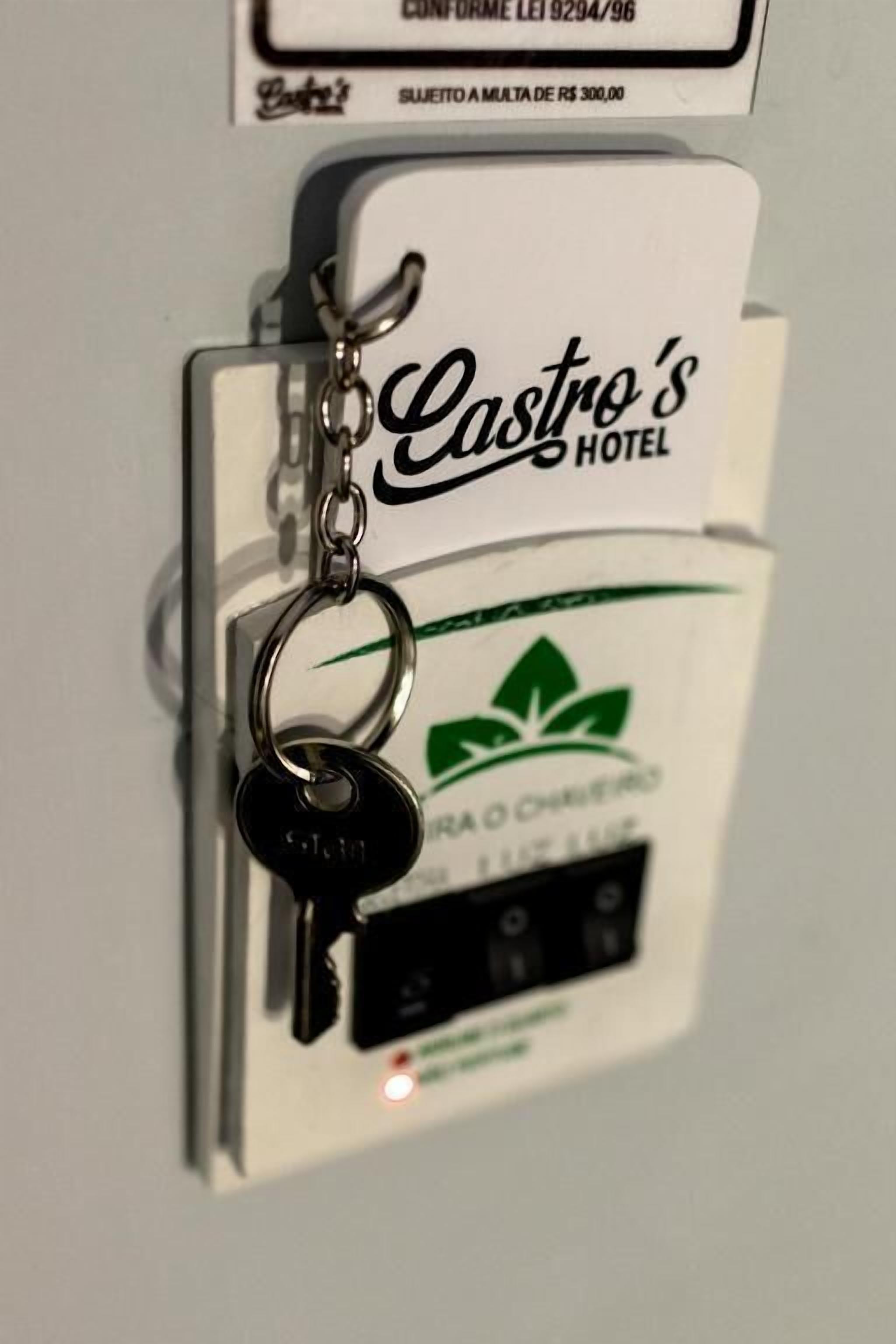 A keychain with "Castro's Hotel" and a green logo.