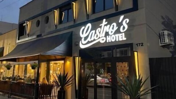 A hotel with a modern facade, large windows, and a sign that reads "Castro's Hotel". - Castro's Hotel (Telemaco Borba)