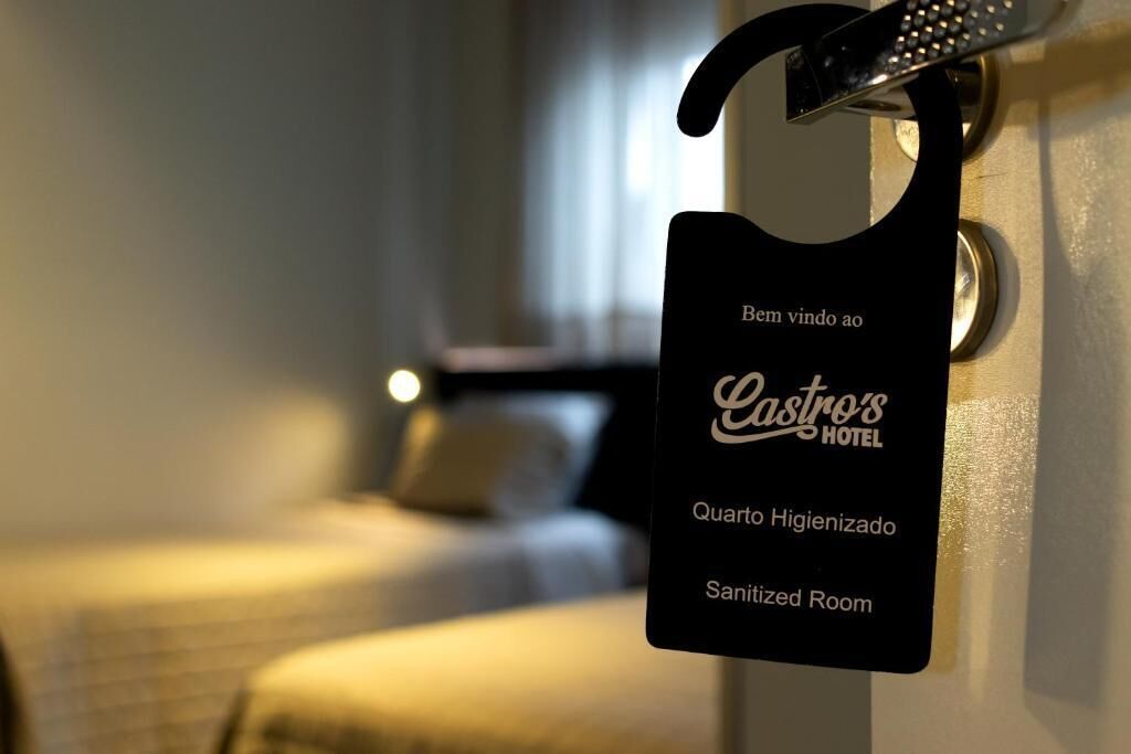 A sign indicating a sanitized room at Castros Hotel.