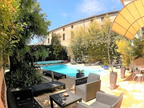 Seasonal outdoor pool, pool loungers