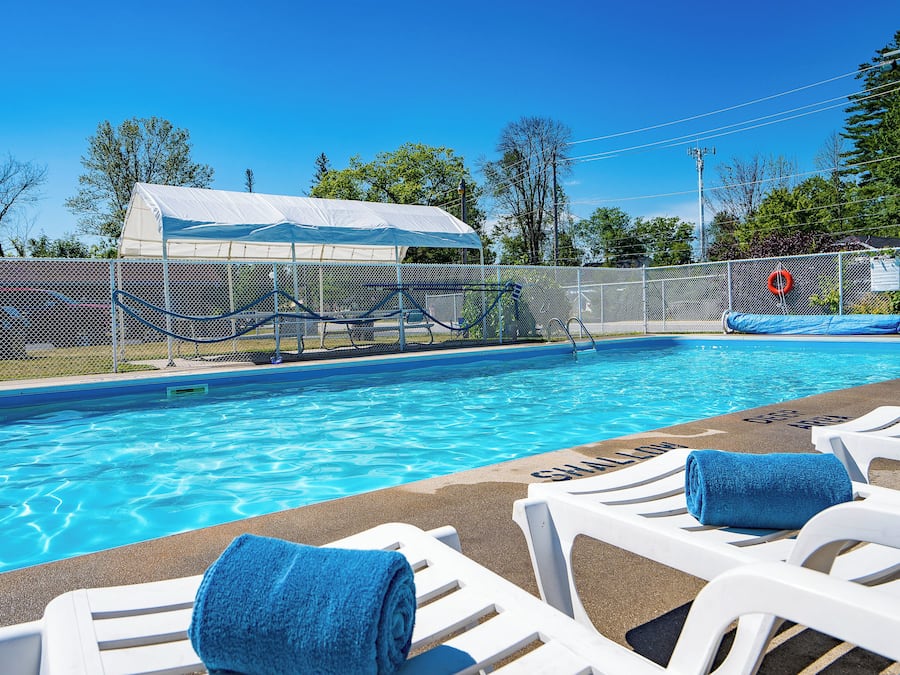 Seasonal outdoor pool, open 8:00 AM to 9:00 PM, pool umbrellas