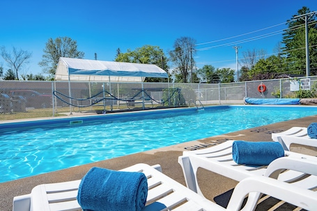 Seasonal outdoor pool, open 8:00 AM to 9:00 PM, pool umbrellas. Beach Club by Beach1 Motel