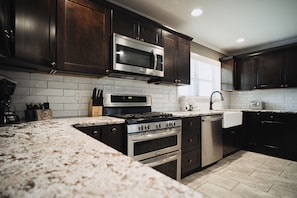 Fridge, microwave, oven, stovetop - 4,900 sq ft, 5 bedroom, large game room, and hot tub next to Rocky Top Sports.  (Gatlinburg)