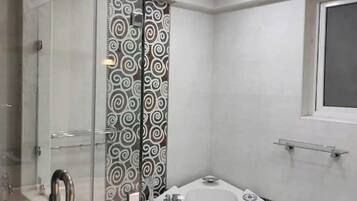 Shower, towels, soap, toilet paper