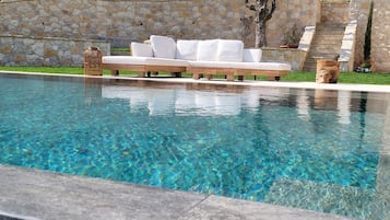 Seasonal outdoor pool, open 7:00 AM to 10:30 PM, pool umbrellas