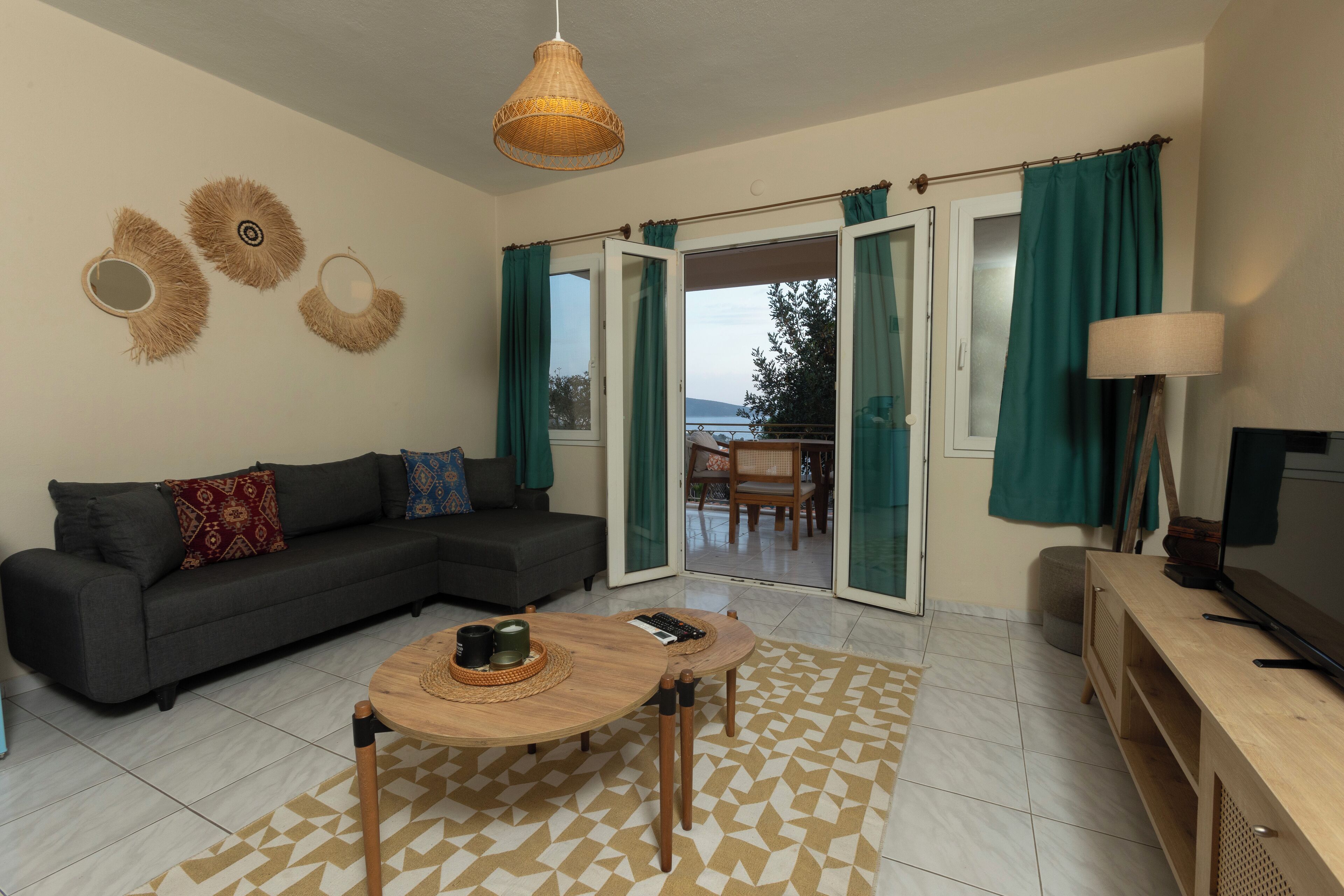 Basic Suite, Partial Sea View | Living area | 40-inch LCD TV with cable channels, TV