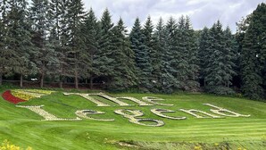 A golf course with a large, landscaped text spelling "The Legend" in the middle of the fairway.