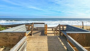 A wooden boardwalk leading to a beach with a wooden bench and a sign. - Top Of THe Hill - High Dune location, 4 BR home w/Private Pool and Dogs Allowed (Southern Shores)