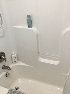 Combined shower/tub, hair dryer, towels, soap