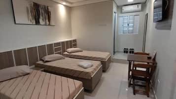 Economy Triple Room | 1 bedroom, bed sheets