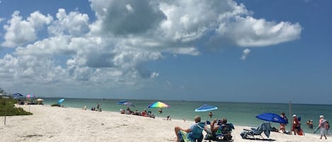 On the beach, sun loungers, beach towels