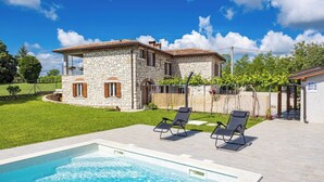 A stone house with a swimming pool and two lounge chairs. - Stone Gem - Villa Katarina with Private Pool (Nedešcina)