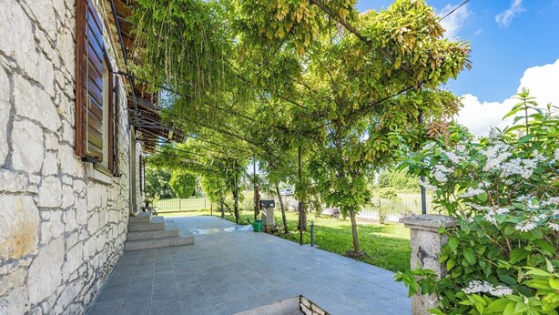 A stone building with a stone staircase leading to a covered patio area. - Stone Gem - Villa Katarina with Private Pool (Nedešcina)