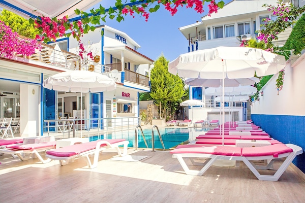 Outdoor pool, open 8:00 AM to 10:00 PM, pool umbrellas, sun loungers