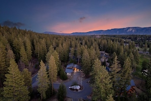 A lodge surrounded by dense forest, with a clear driveway leading to the main building. - Family Friendly w/ Suncadia Pool Access (Cle Elum)