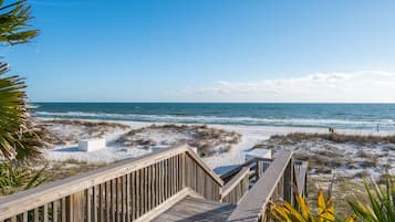 Walk along the boardwalk to the sandy beach with ocean views.