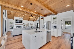 Cozy living space with a central island, sink, and cabinetry, perfect for relaxing and cooking.