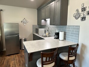 Fridge, microwave, stovetop, coffee/tea maker