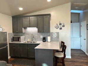 Fridge, microwave, stovetop, coffee/tea maker