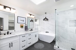 Combined shower/tub, hair dryer, towels, soap