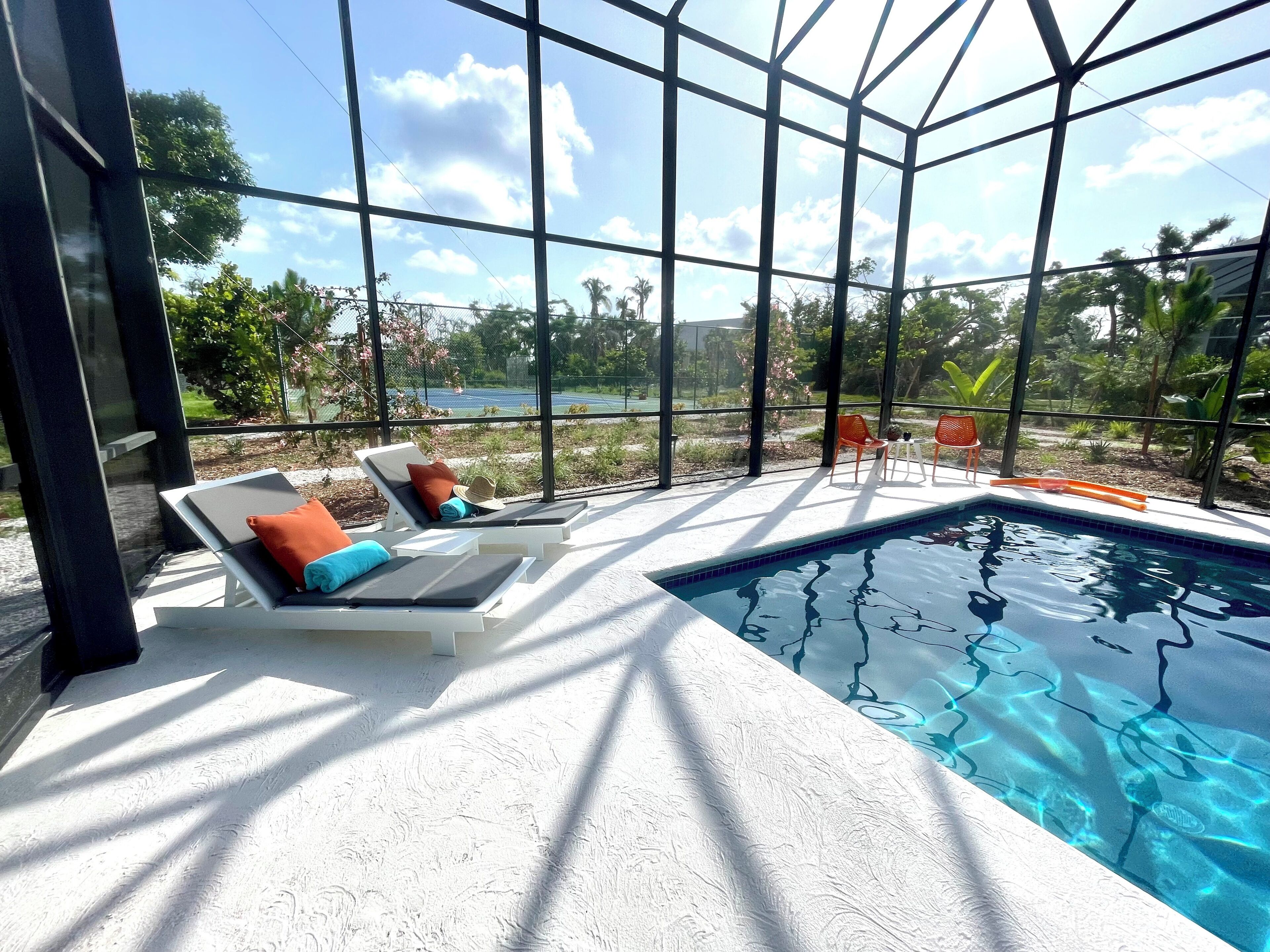 Modern beachfront home with pool and private tennis court