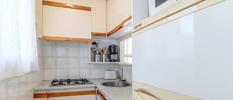 Microwave, toaster, cookware/dishes/utensils, dining tables