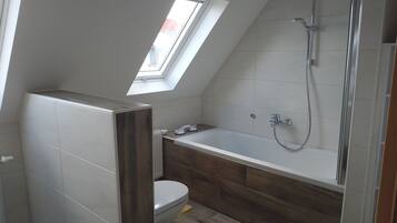 Bathtub, hair dryer, towels