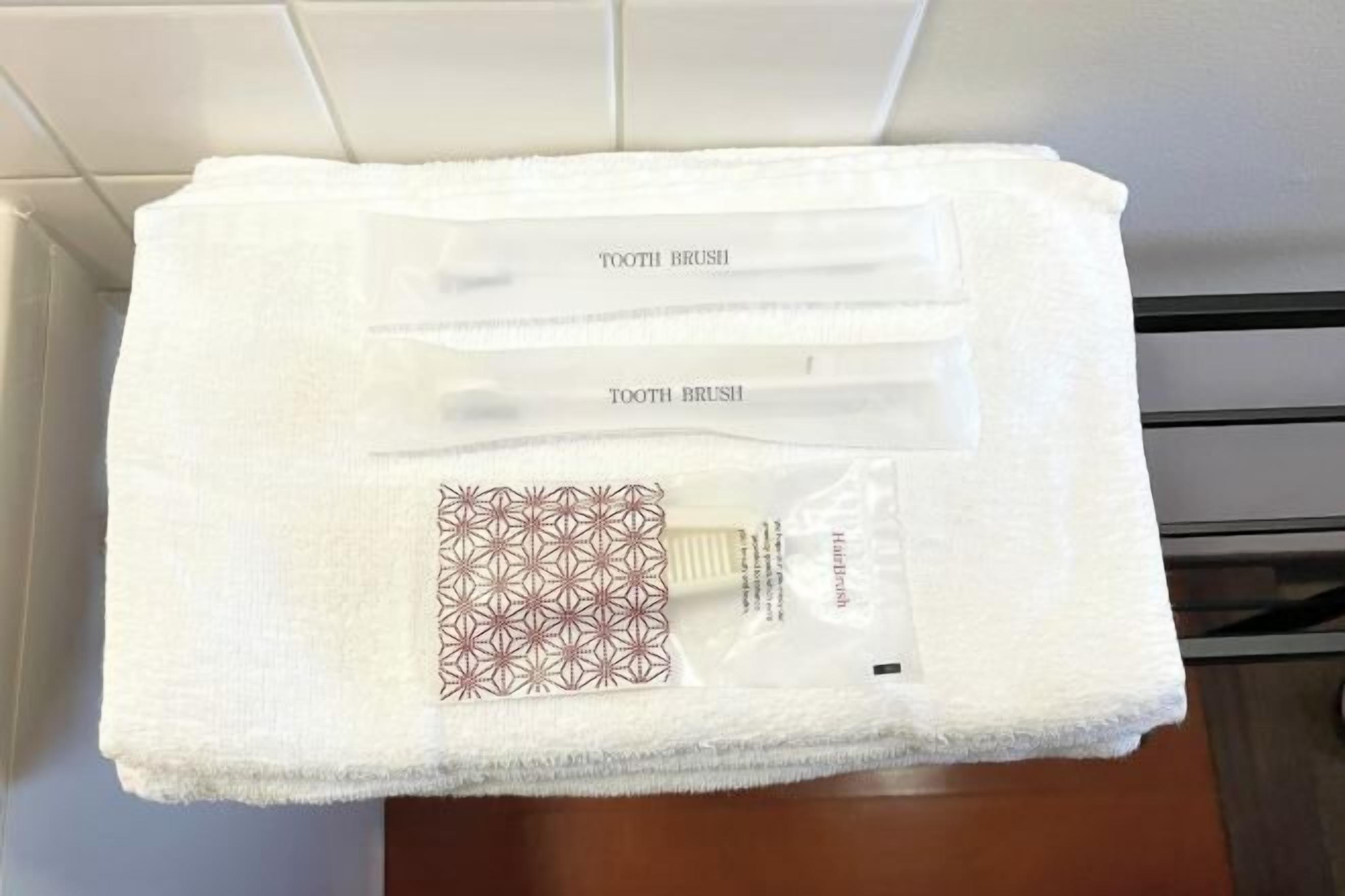 Hair dryer, slippers, towels, shampoo