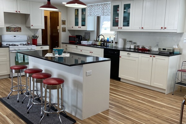 Open concept kitchen with big island complete with swivel diner stools!